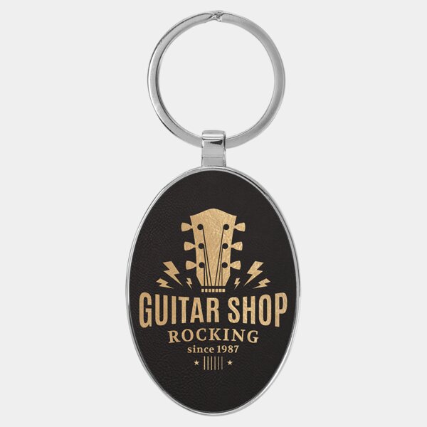 Personalized 3" x 1 3/4" Laserable Leatherette/Metal Black/Gold Oval Keychain Thumbnail
