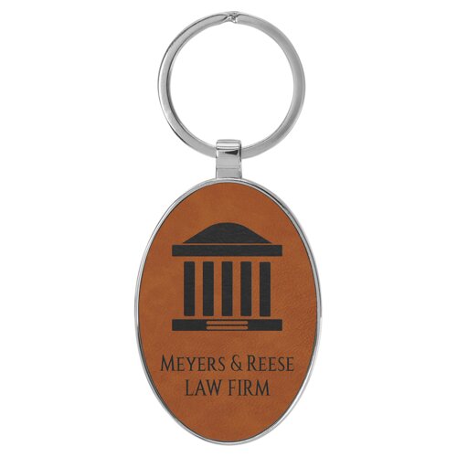 Personalized 3" x 1 3/4" Laserable Leatherette/Metal Rawhide Oval Keychain Thumbnail