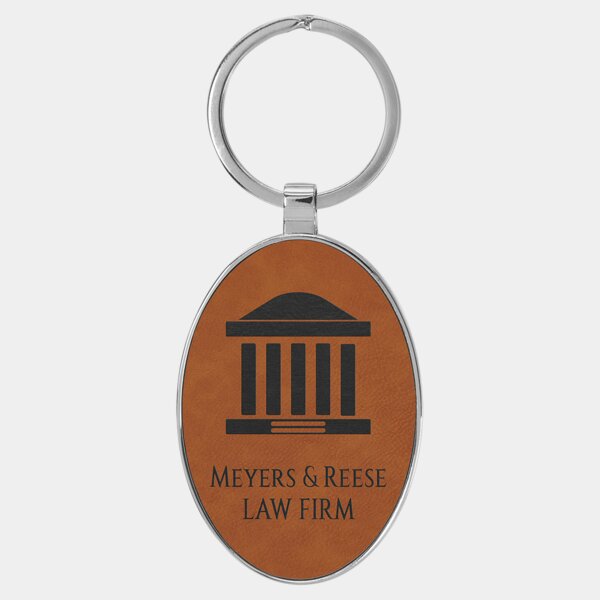 Personalized 3" x 1 3/4" Laserable Leatherette/Metal Rawhide Oval Keychain Thumbnail