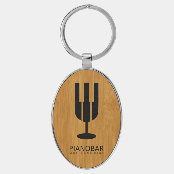 Personalized 3" x 1 3/4" Laserable Leatherette/Metal Bamboo Oval Keychain Thumbnail